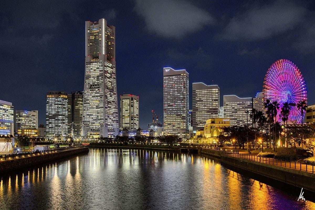 Minato Mirai in Yokohama at blue hour with Landmark Tower, Ferris wheel and golden reflections in the water – photographic art by Bernhard Houy