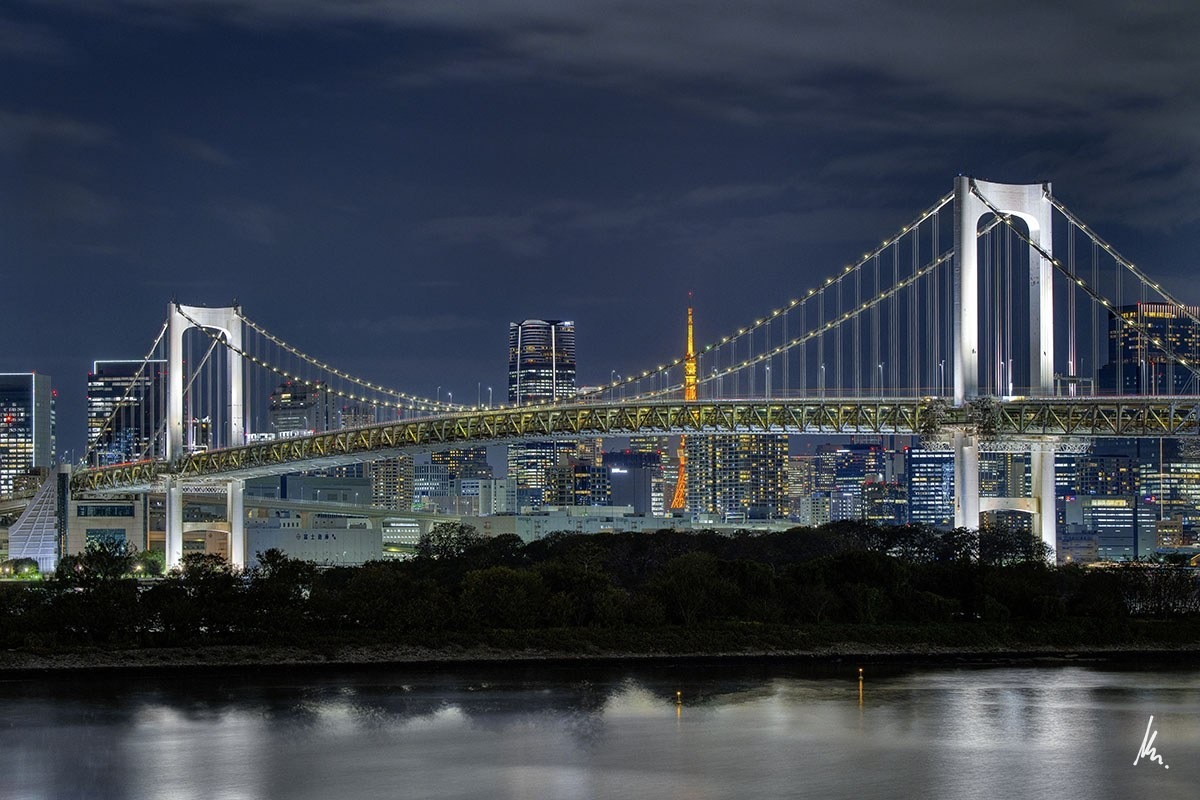 Rainbow Bridge at night with Tokyo Tower and the Tokyo skyline – photographic art by Bernhard Houy, Lights Beyond the Bridge