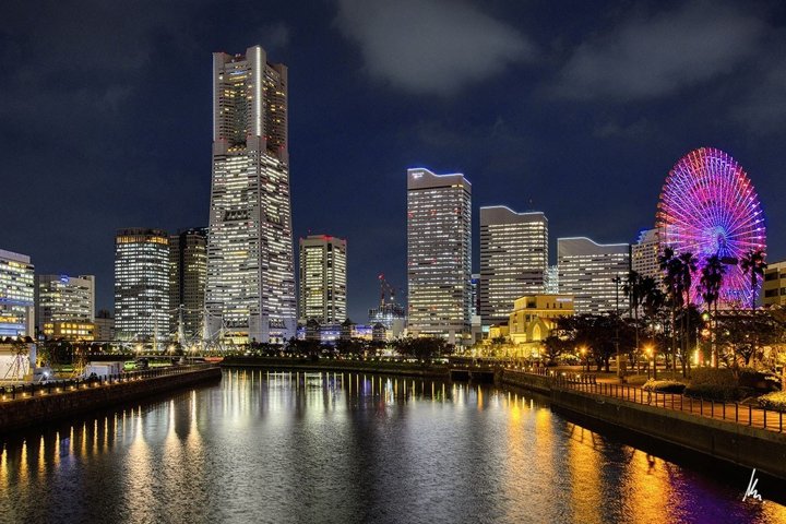 Minato Mirai in Yokohama at blue hour with Landmark Tower, Ferris wheel and golden reflections in the water – photographic art by Bernhard Houy